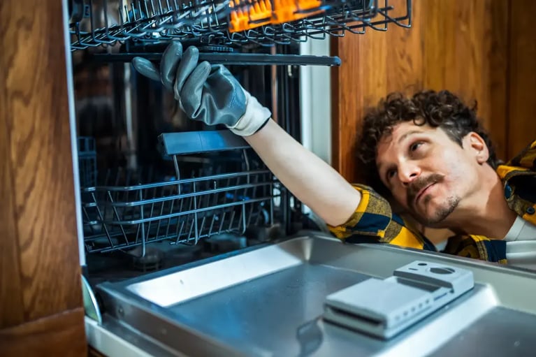 Man installing dishwasher